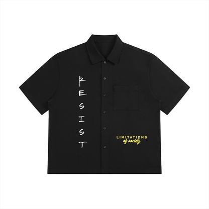 Unisex Resist 100% Cotton Oversized Drop-Shoulder Short Sleeve Shirt With Patch Pocket, black front view with button closure, chest pocket, and Resist lettering
