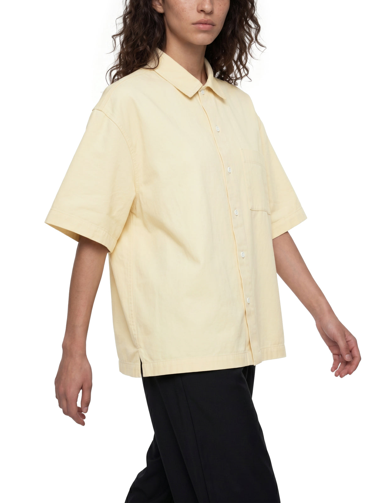 Unisex Resist 100% Cotton Oversized Drop-Shoulder Short Sleeve Shirt With Patch Pocket, cream short sleeve shirt modeled with relaxed streetwear styling